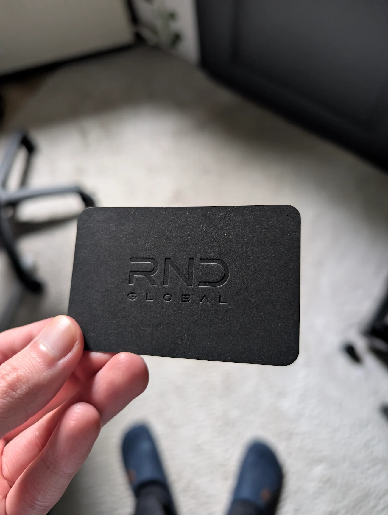 Black embossed RND Global business card.